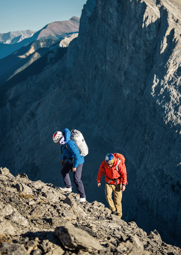 Two people hiking in the mountains.
