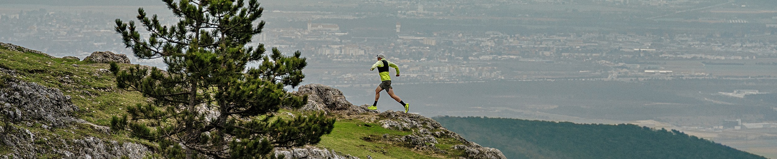 Person running on a mountain trail