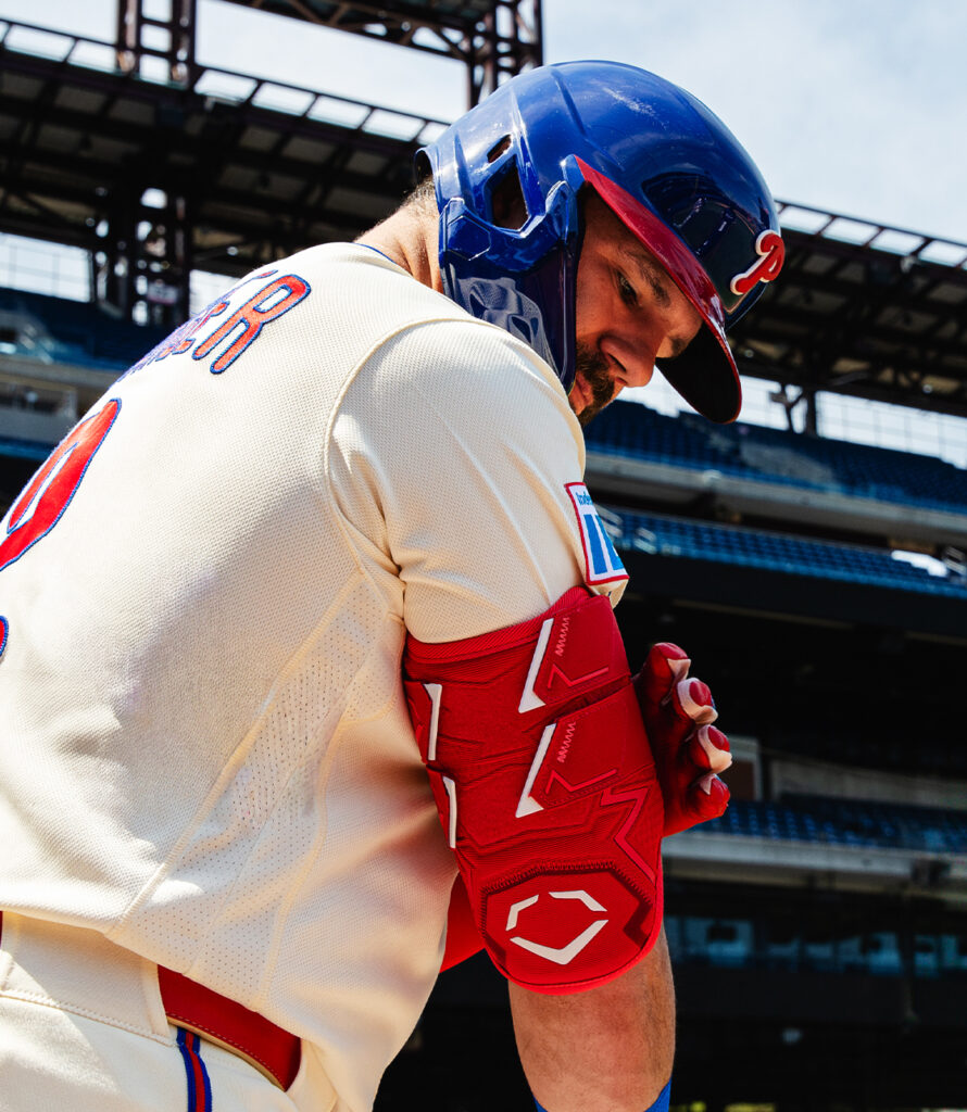 Athlete wearing an EvoShield protective arm guard during a baseball game.