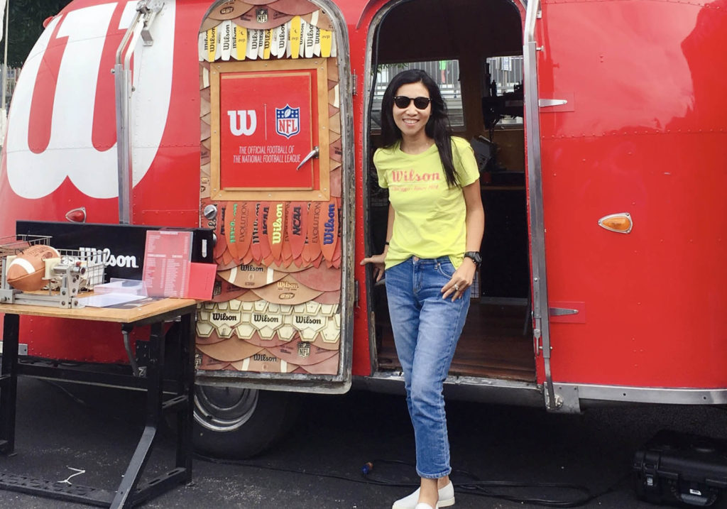 MingYu XU in front of a Wilson branded  Airstream