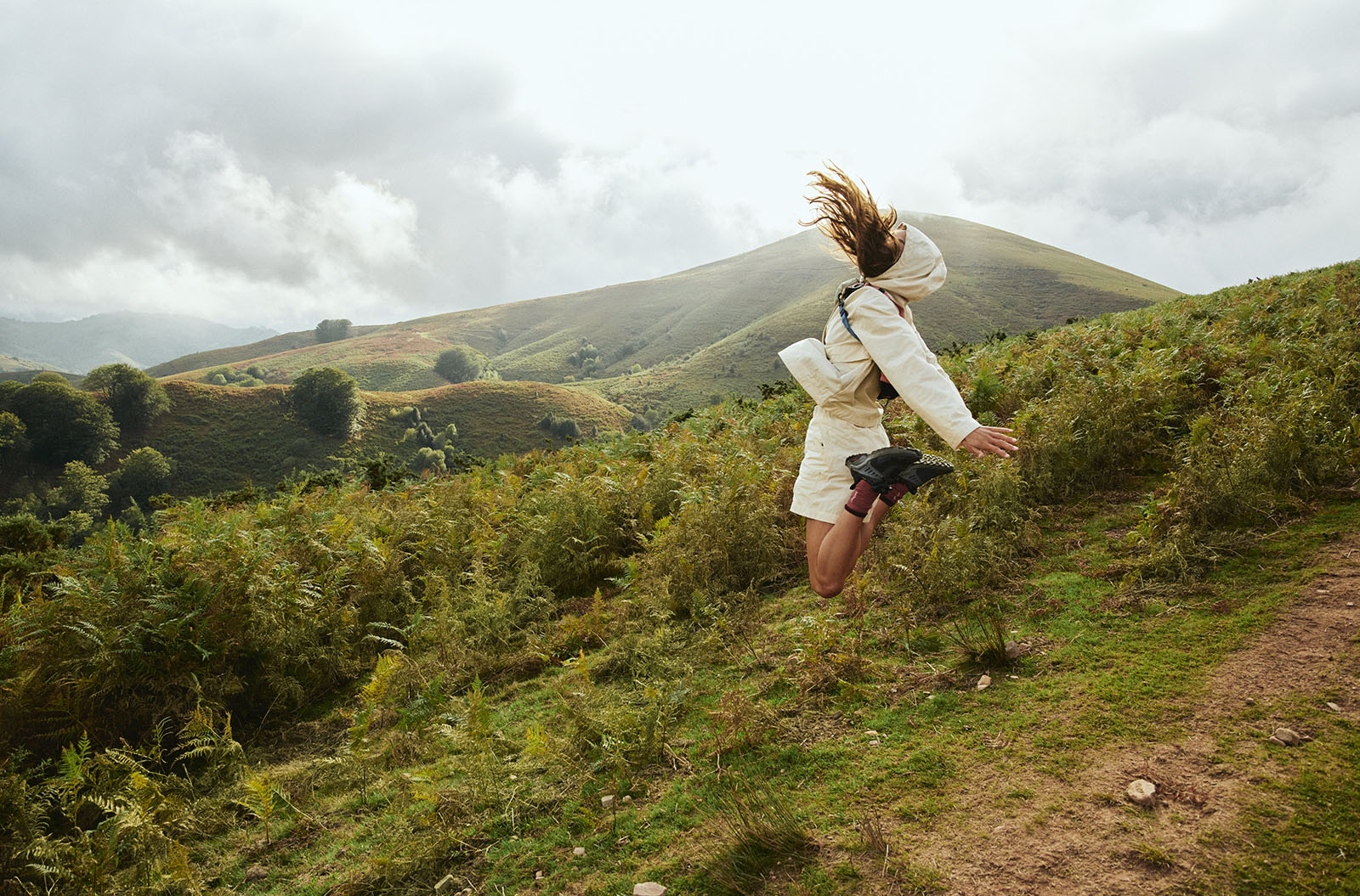 Person jumping outdoors in Peak Performance clothing