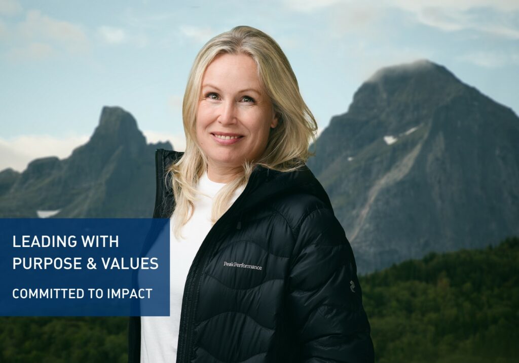 Portrait picture of Anne Larilahti with mountains as backdrop.