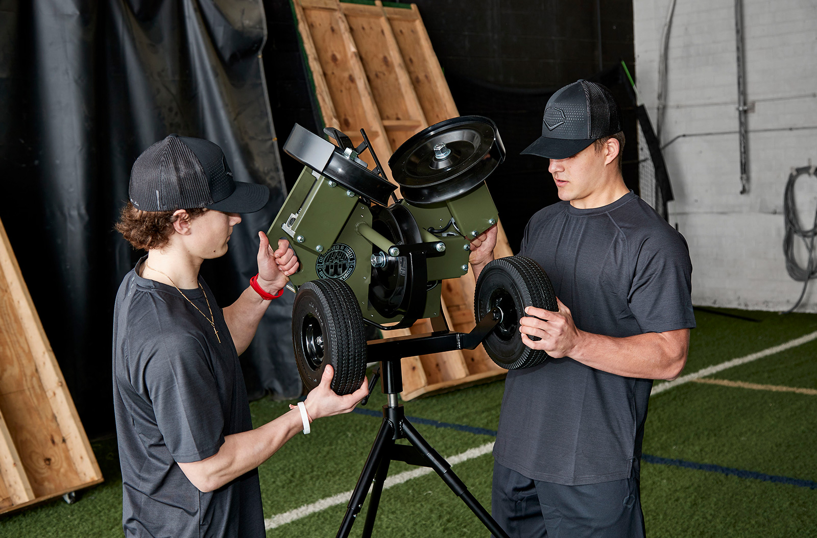 Two people using Atec's machinery.