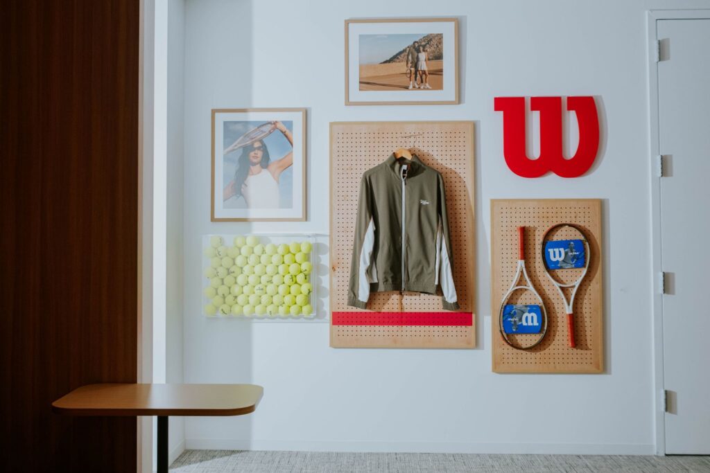 Office wall decorated with Wilson products and images.